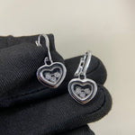 Shiny three-diamond heart earrings, white-gold heart with three round diamonds