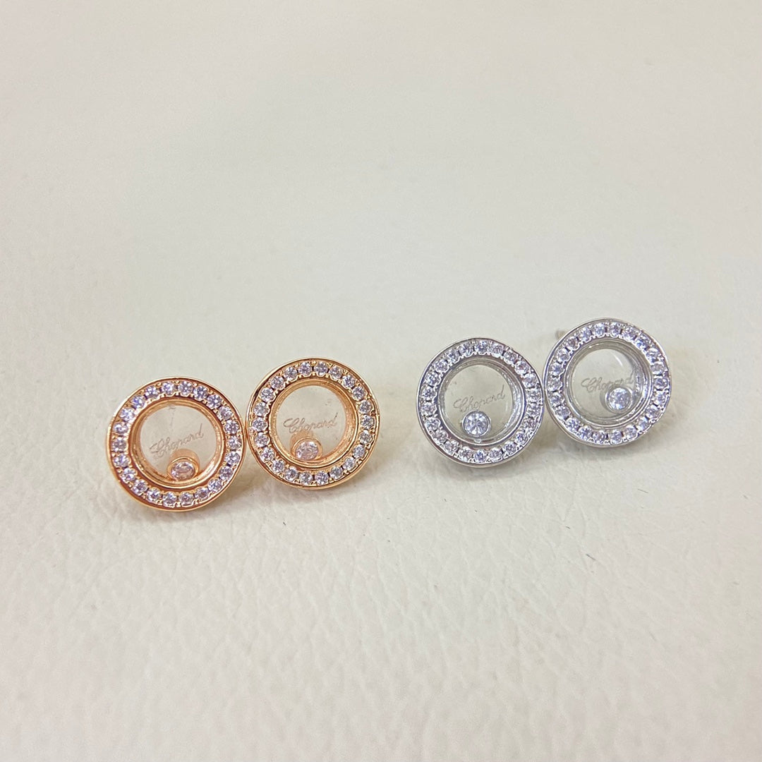 Round diamond-studded stud earrings with circular halo and central logo
