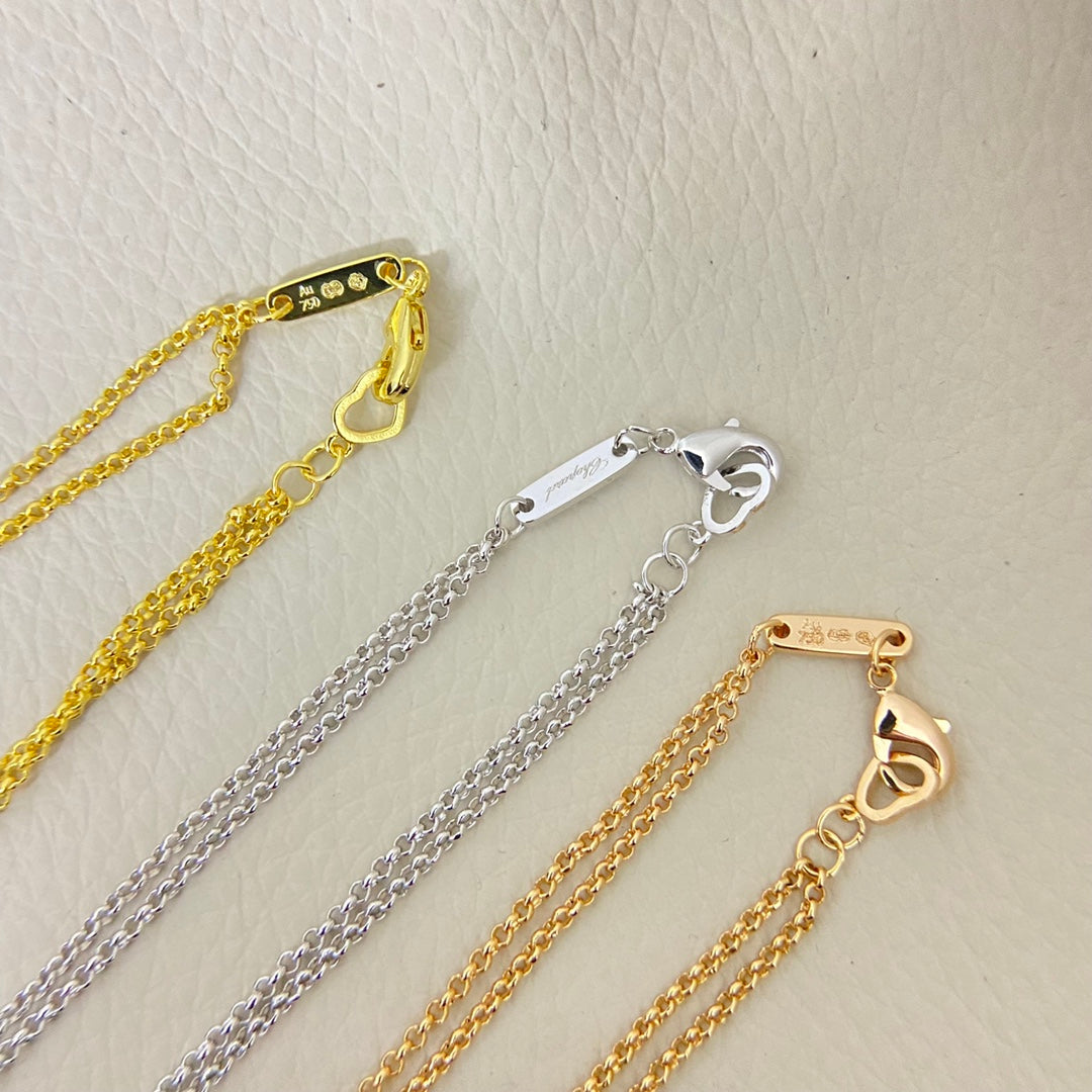 Set of heart pendant necklaces with diamond pavé hearts on gold and silver chains