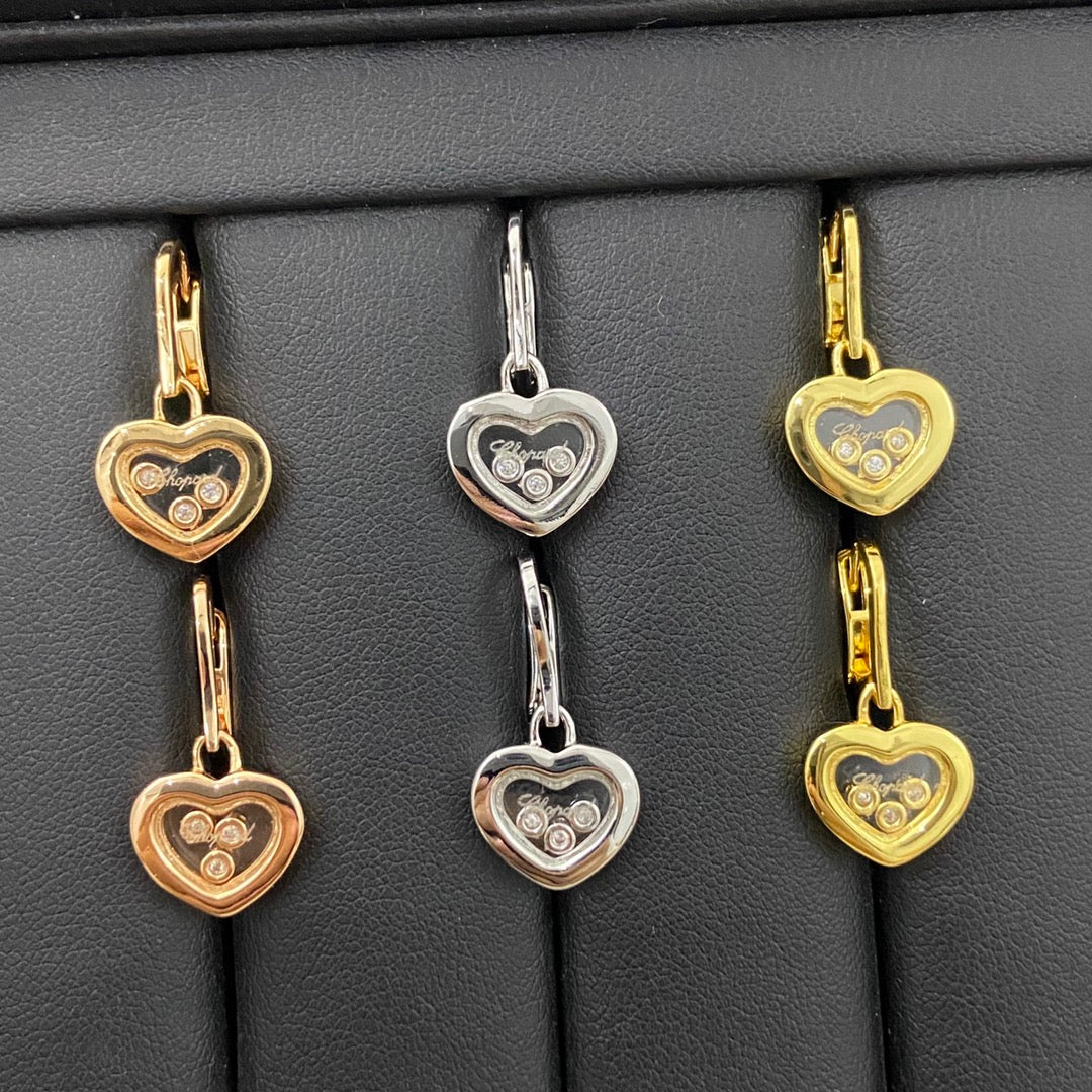 Heart earrings set: rose gold, white gold, and gold-tone hearts with three diamonds