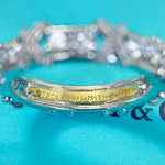 Inside stamp on white gold color crossover ring band: 925, Tiffany & Co.