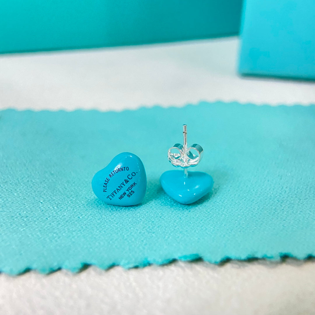 Blue enamel heart stud earrings with clear butterfly backs