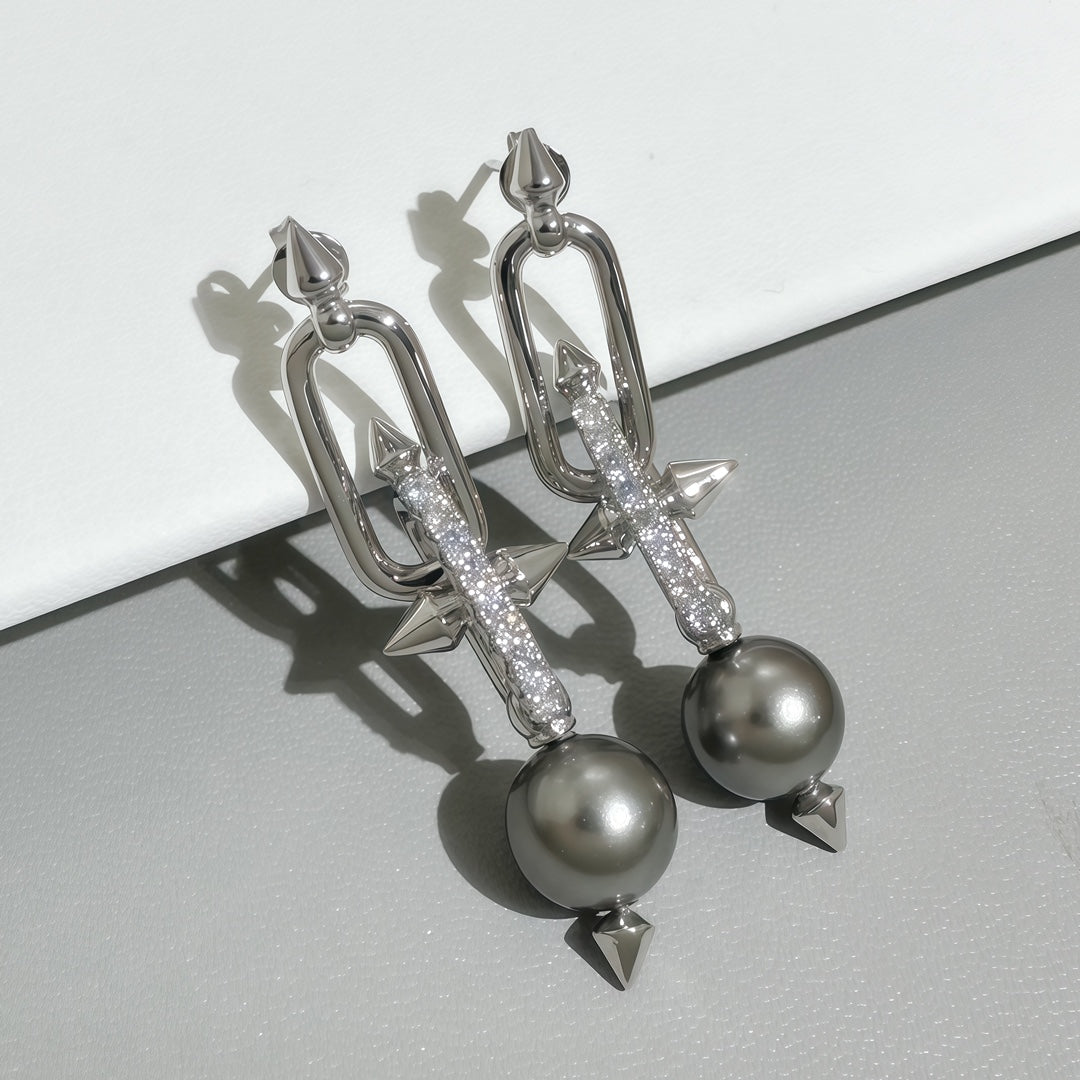 Silver-tone earrings with gray pearls, glitter bar links and pointed bow tips