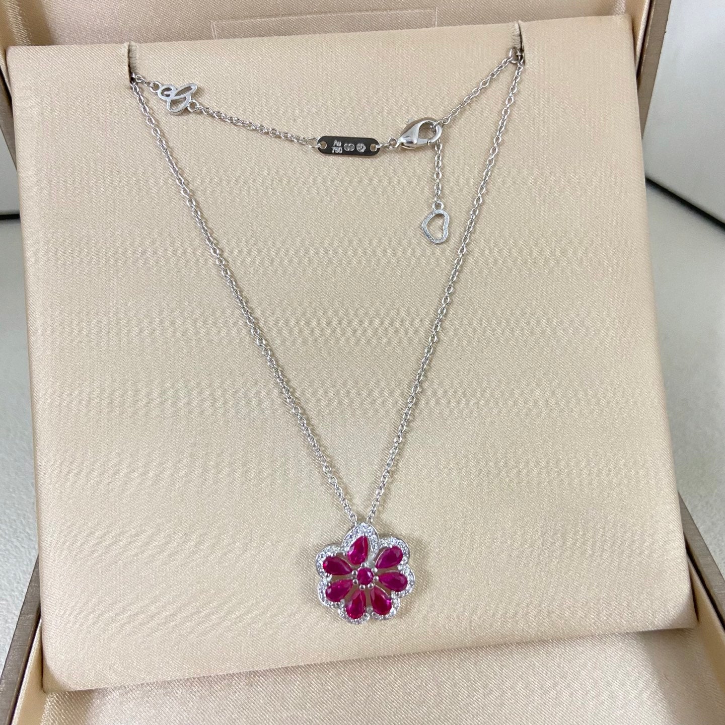 Gemstone flower pendant necklace with maroon floral pendant on silver-tone chain