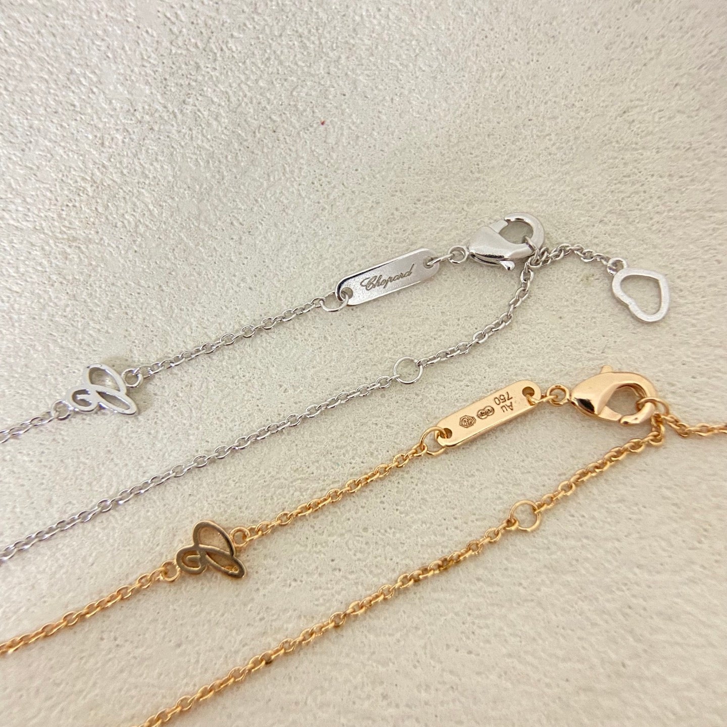 Chopard necklace chain and clasp with engraved bar and heart-shaped connector on links