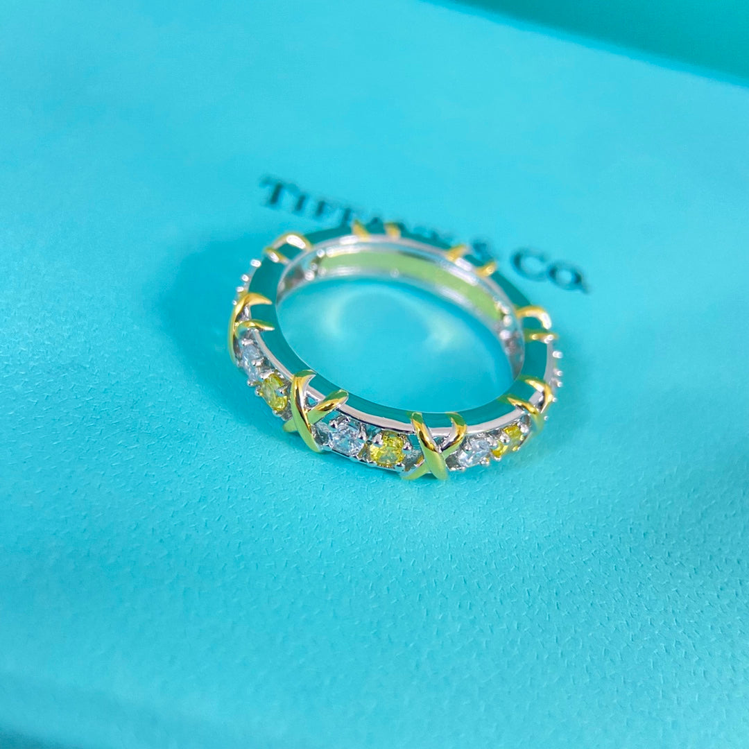 Two-tone diamond-set ring, gold and silver band with clear and yellow stones
