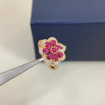 Gold openwork petal diamond ring with pink stones