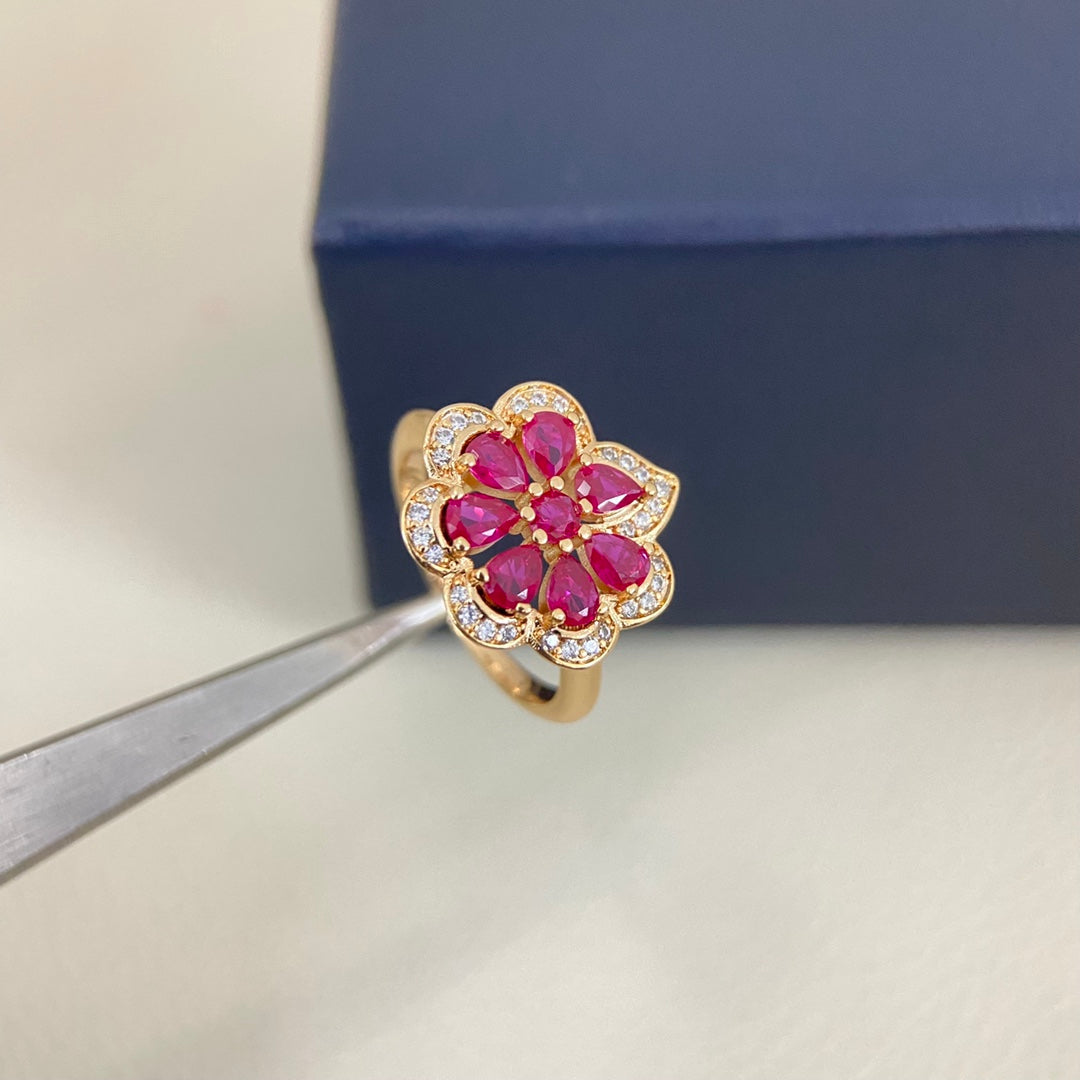Gold openwork petal diamond ring with pink stones