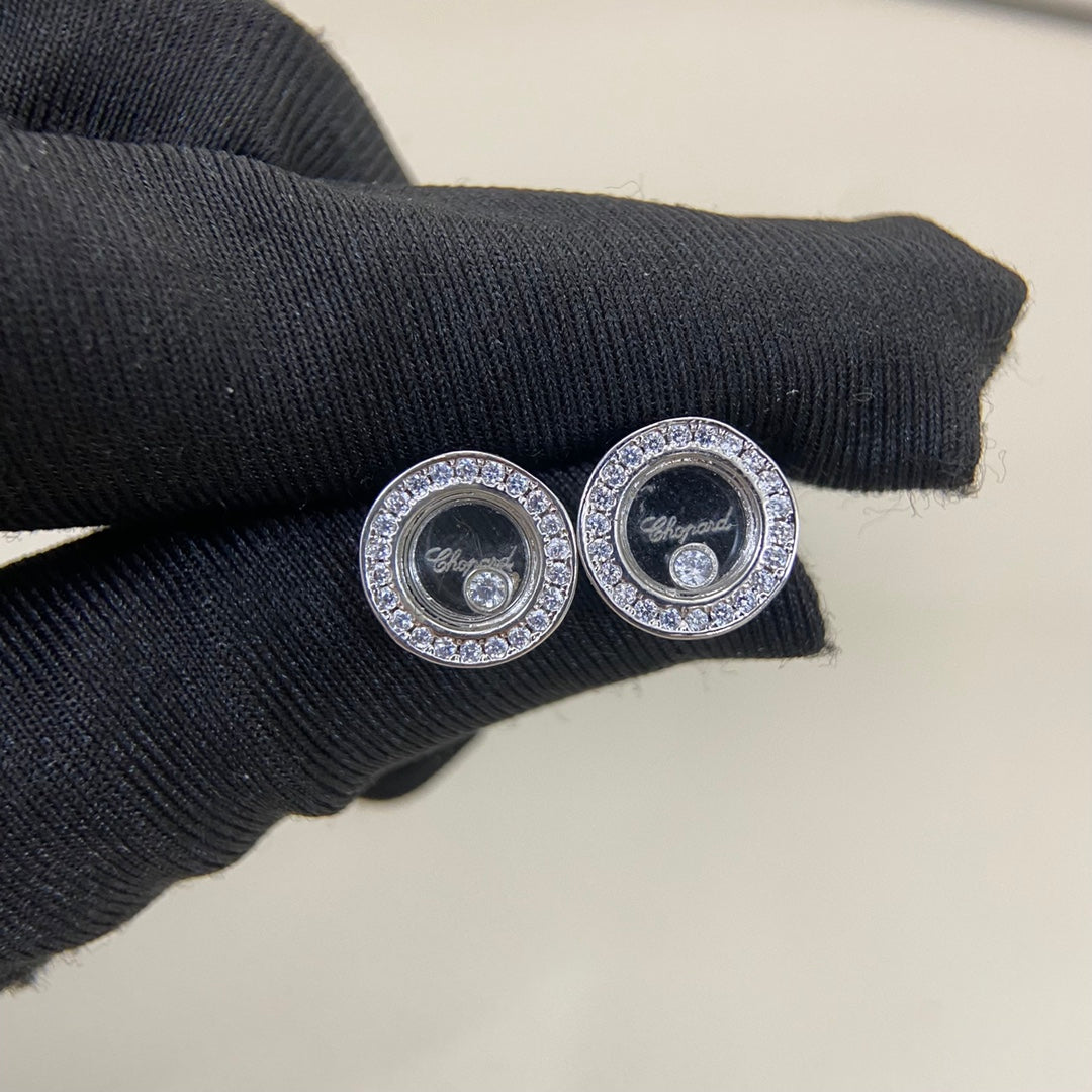 White metal round diamond stud earrings with textured outer halo