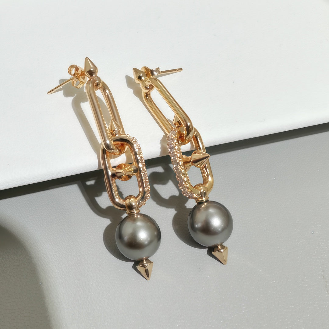 Rose-gold tone earrings with gray pearls and rhinestone link bars