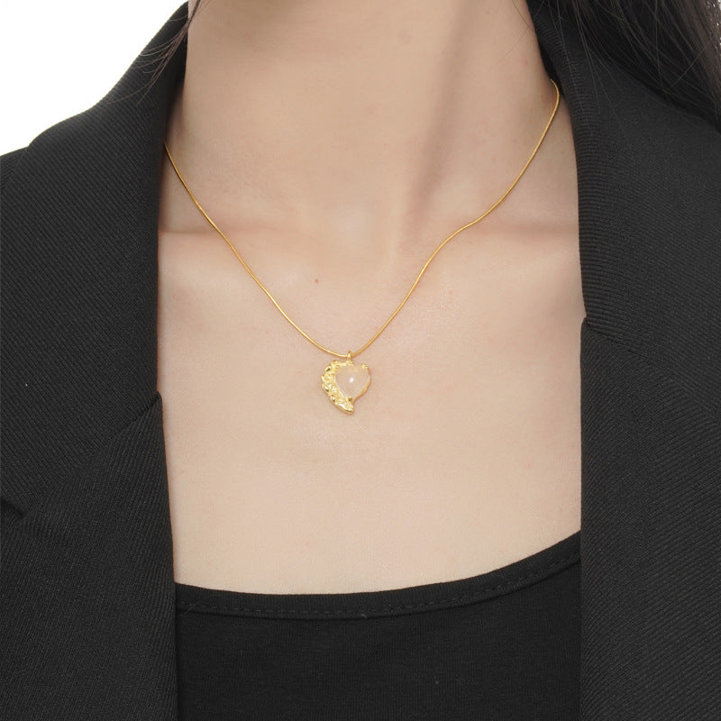 Gold-tone snake chain necklace with heart agate pendant