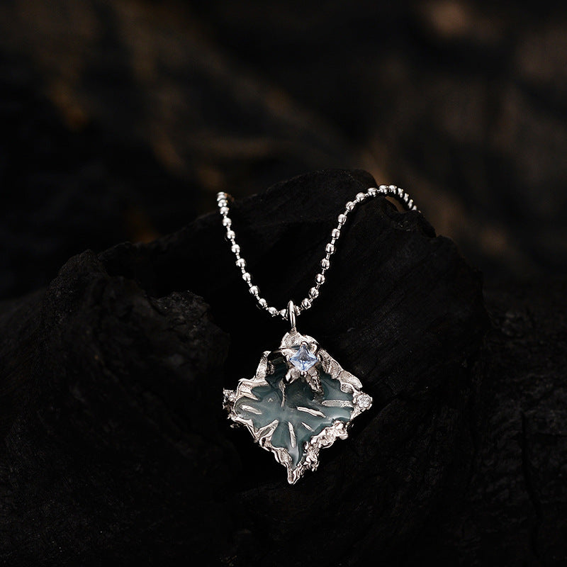 Contemporary Silver Necklace with a Wavy Blue Centerpiece

