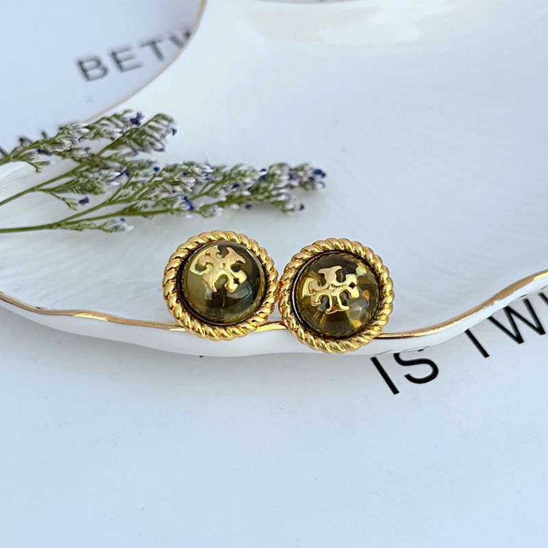 Round metal stud earrings, gold-tone bezel with dark green resin face