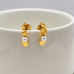 Asymmetrical pearl heart and star earrings, gold-tone with white pearl drops
