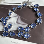 Silver-tone crystal necklace with blue oval and teardrop faceted stones