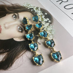 Blue heart-shaped crystal drop earrings with gold-tone links