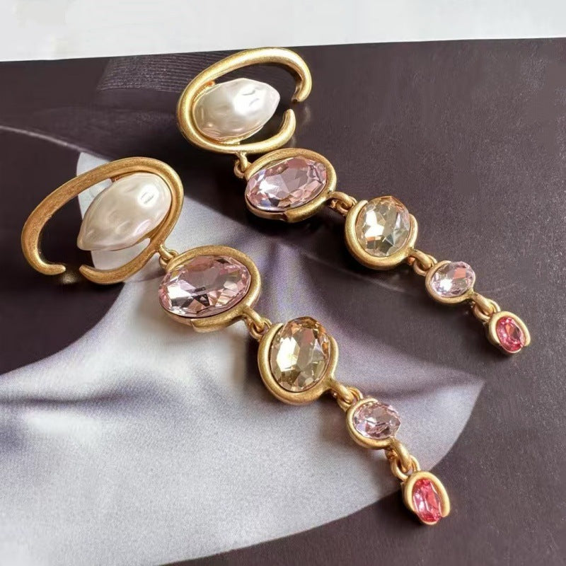 Long crystal drop earrings in gold with pink and champagne oval stones