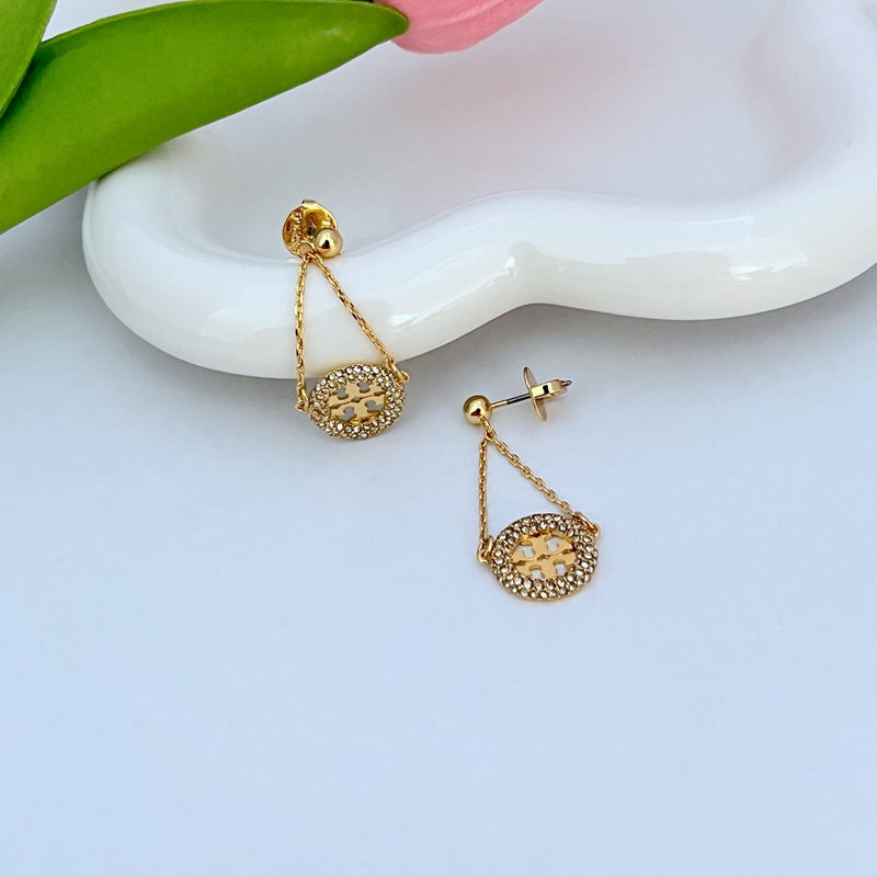 Gold pavé rhinestone hoop drop earrings with round dangling charm and stud backs