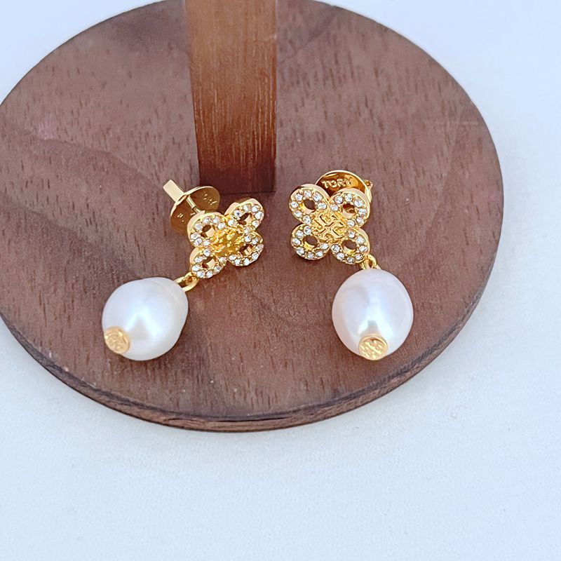 Four-leaf clover pearl drop earrings in gold tone with round white freshwater pearls