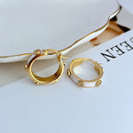 Tory Burch enamel logo hoop earrings, gold-tone with white enamel and logo charm details
