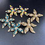 Starfish flower enamel earrings, mixed blue, purple and yellow accents, gold-tone