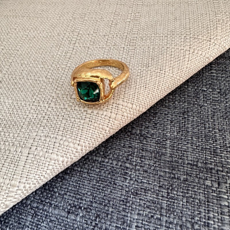 Square gemstone ring with deep emerald green stone in textured gold band