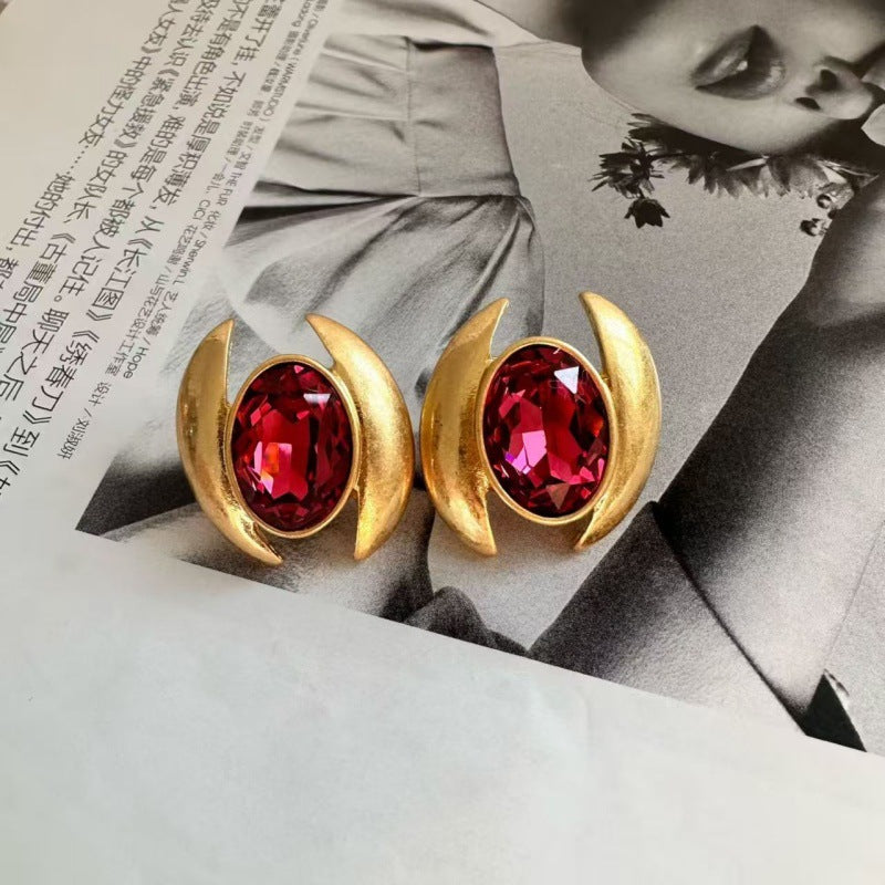 Oval Sparkling Crystal Earrings: red oval crystals with gold crescent settings