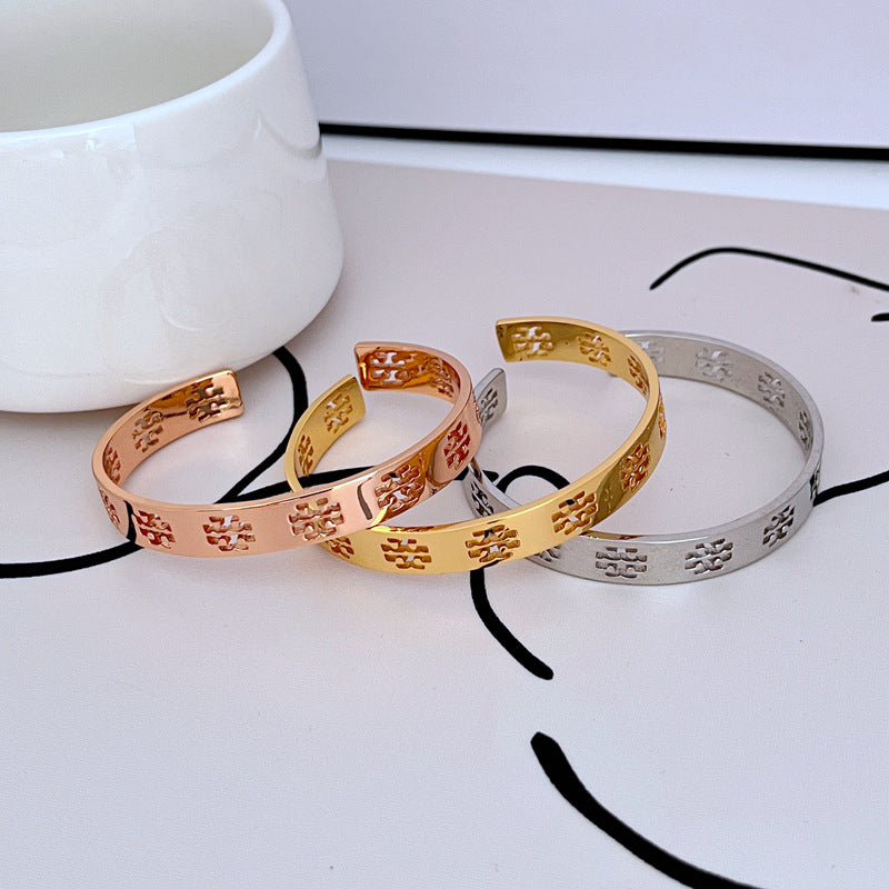 Tory Burch Commuter Style Openwork Logo Metal Bangle