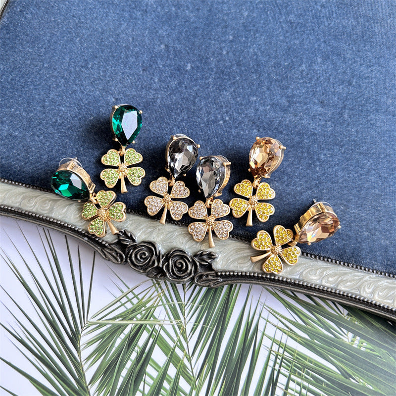 Four-leaf clover earrings with mixed stones: green, clear/gray, and champagne with gold-tone settings