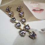 Purple heart-shaped crystal drop earrings with gold-tone chain