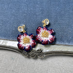 Vintage enamel cherry blossom earrings in dark red and white with gold beaded centers
