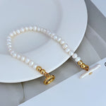 Freshwater pearl bracelet with gold-tone toggle rings and bead clasp ends