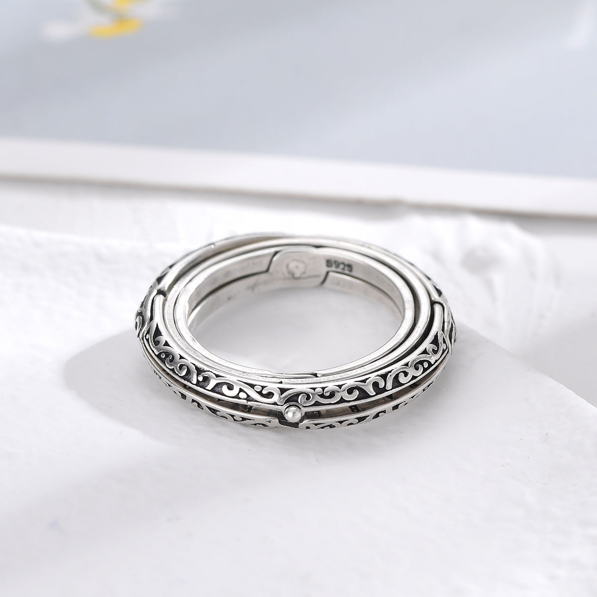Silver engraved ring band with filigree details and open circular inner frame