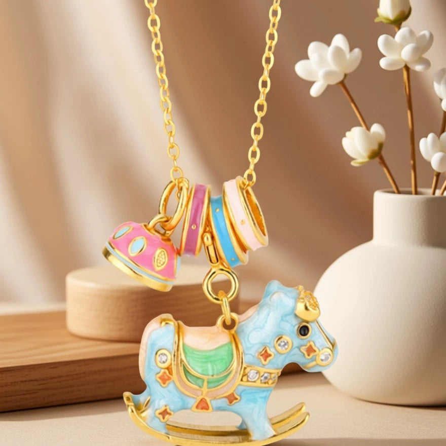 Enamel rocking horse necklace with gold chain, blue horse charm and striped teacup charms