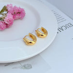 Tory Burch petite U-shaped hoop earrings, gold tone, smooth finish