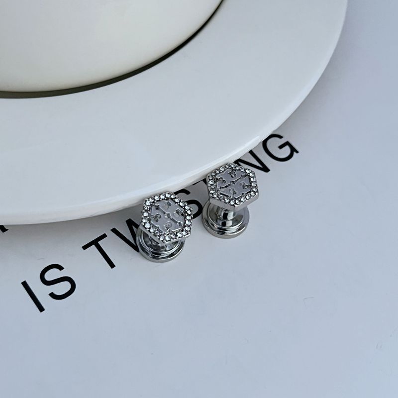 Hexagonal metal stud earrings with openwork diamond pattern, white gold color