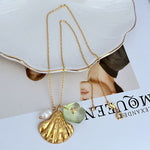 Gold-tone shell pendant necklace with mint-green acrylic bead and white pearl