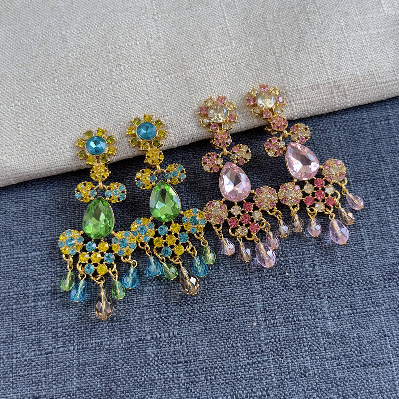 Rhinestone tassel clip-on earrings with green, blue, and gold floral drops