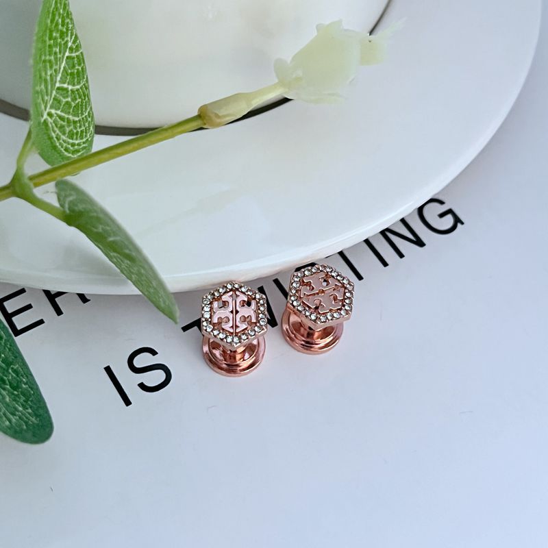 Hexagonal metal stud earrings with openwork diamond pattern, rose gold color