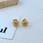 Candy-colored enamel flower stud earrings, gold-tone with white petals and red motif