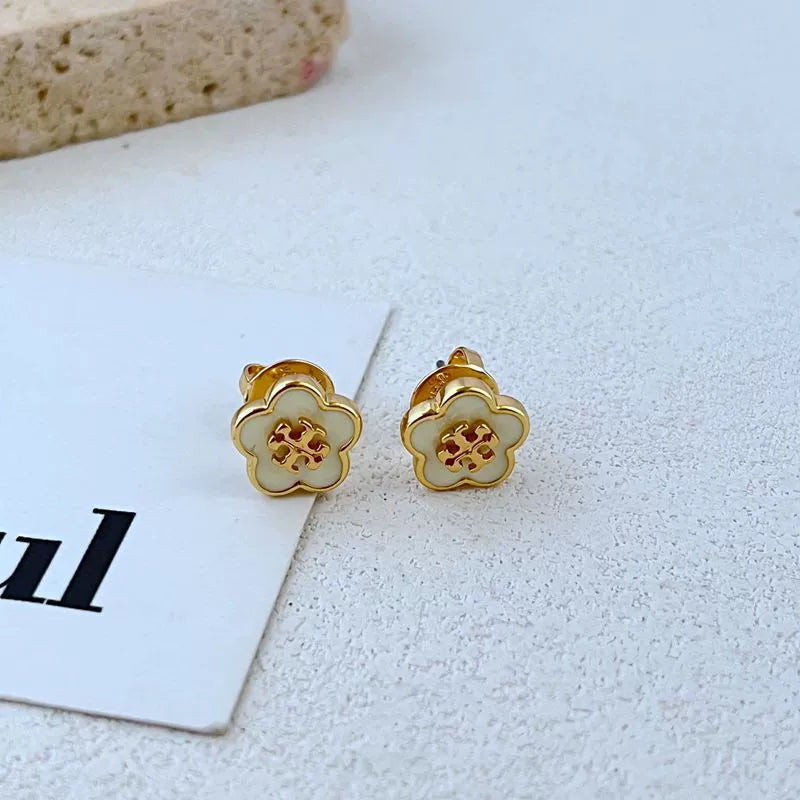 Candy-colored enamel flower stud earrings, gold-tone with white petals and red motif