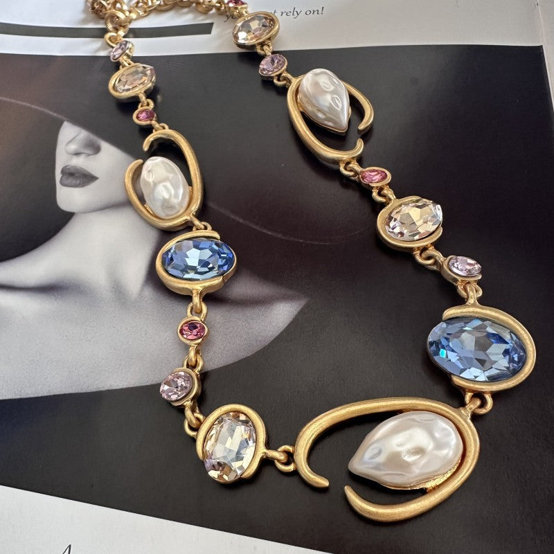 O-ring glass pearl necklace, blue crystal oval stones and white pearls on gold chain