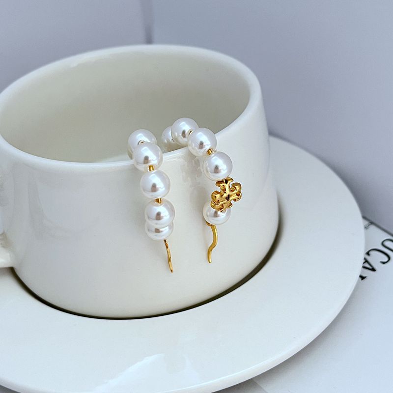 Gold-tone dangle hoop earrings with round white pearls and gold charm
