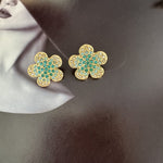 Diamond colorful floral stud earrings in gold with teal and clear stones