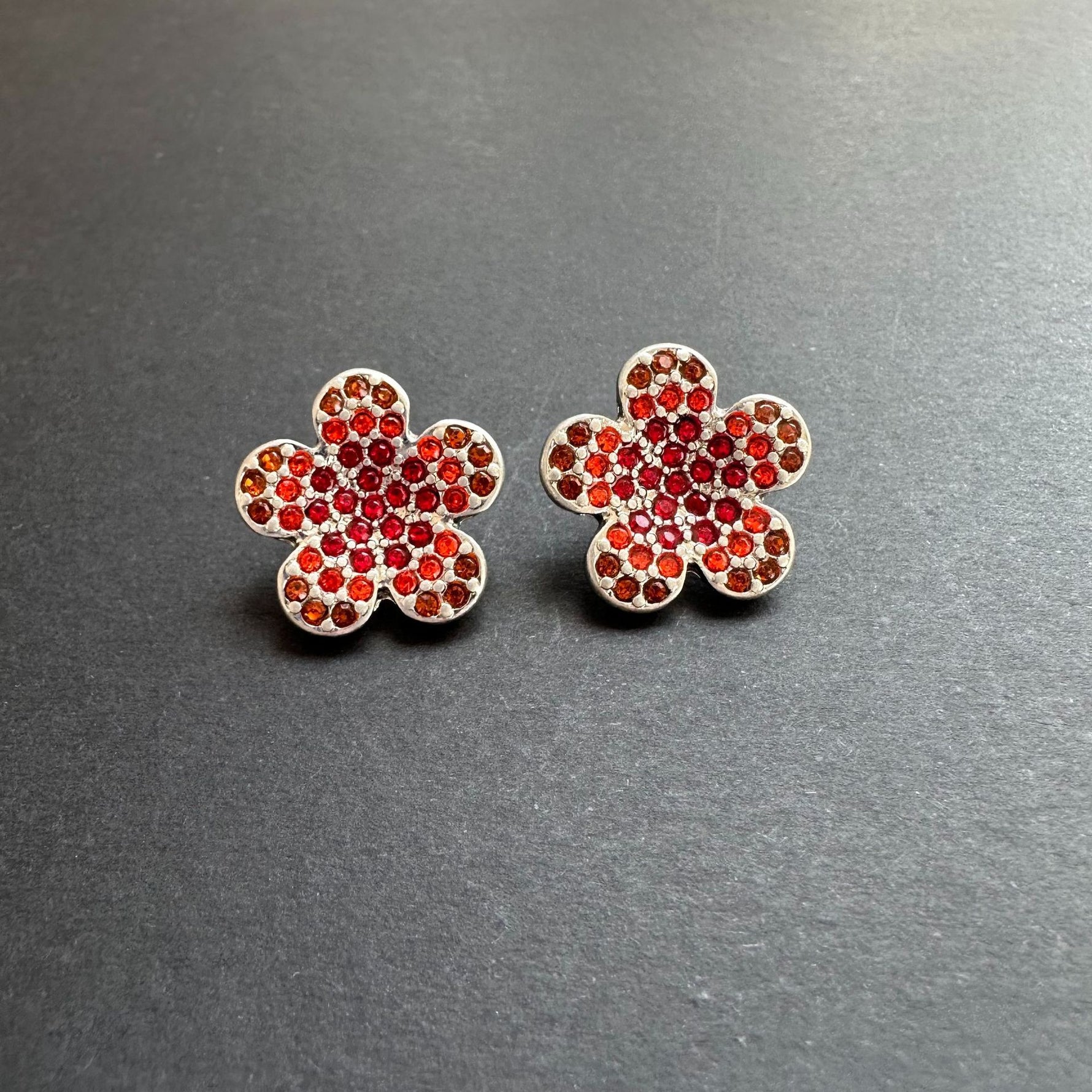 Diamond colorful floral stud earrings in silver with red stones and clear accents