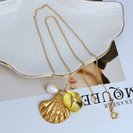 Gold-tone shell pendant necklace with yellow acrylic bead and white freshwater-style pearl