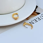 Geometric enamel hoop earrings, gold-tone with pink enamel and charm detail