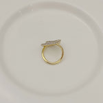 Gold-tone ring with pavé crystal double-loop design