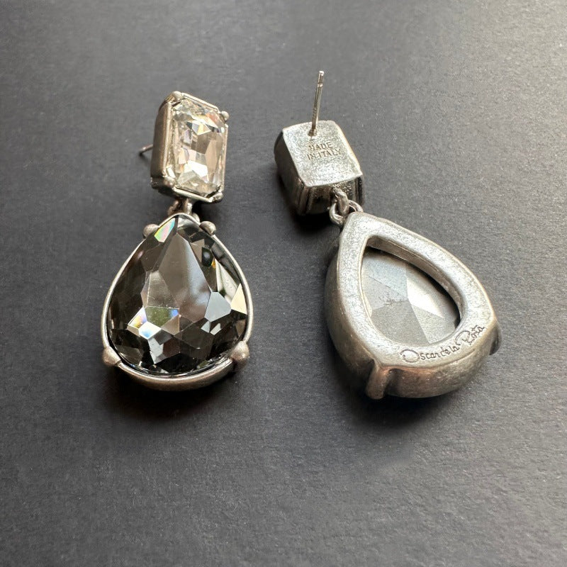 Teardrop-cut diamond stud earrings in silver-tone with clear and dark stones, post backs