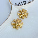 Gold 3D logo metal hoop earrings, sculpted floral emblem (pair)